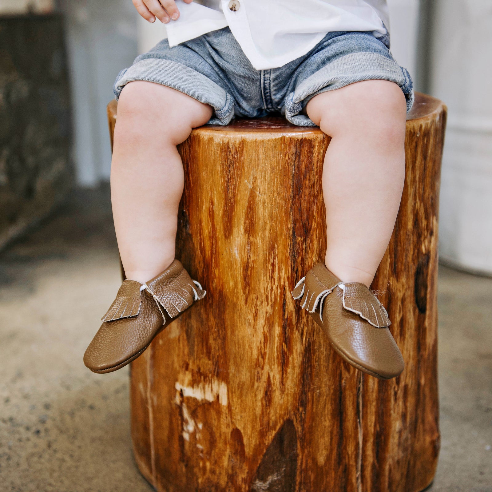 Boy wearing brown leather soft sole shoes