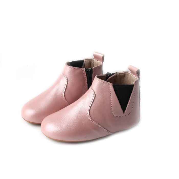 Pink leather toddler shoes side view. I pair view from the side. Featuring elastic sides with zip on ankle. 