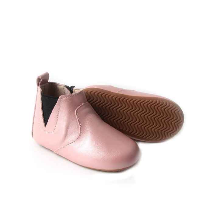 Leather toddler boots in pink. Showing flexible rubber sole. Elastic Sided boots with ankle zip.