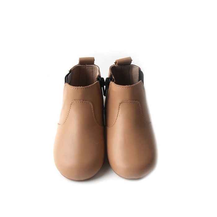 View from above toddler boots in light  tan colour. Featuring stitching detail over the top of foot